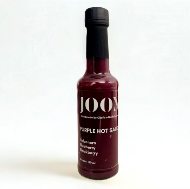 Bottle of JOOX Purple Hot Sauce on a white background